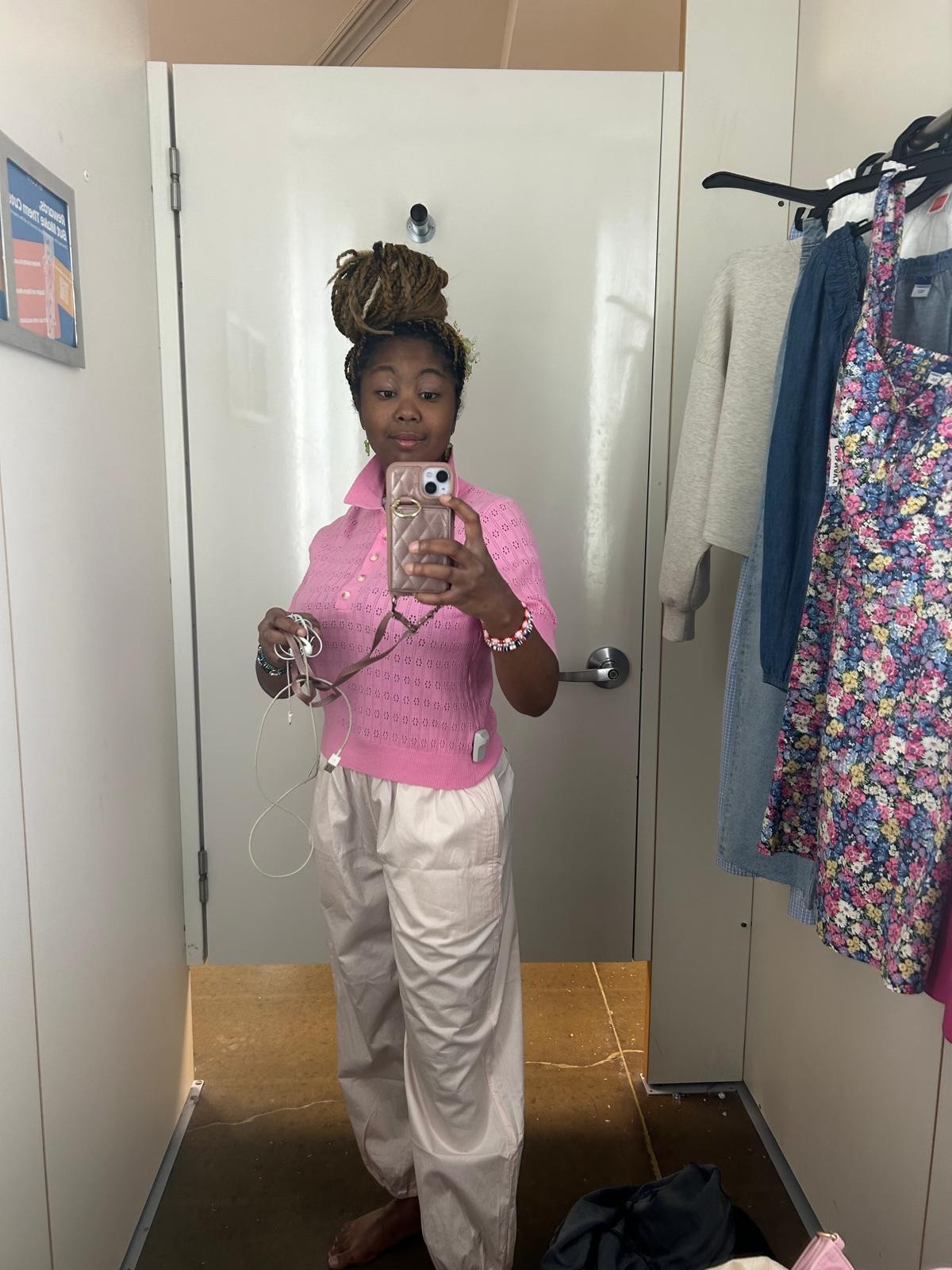 Kimberly's daughter trying on clothes while shopping