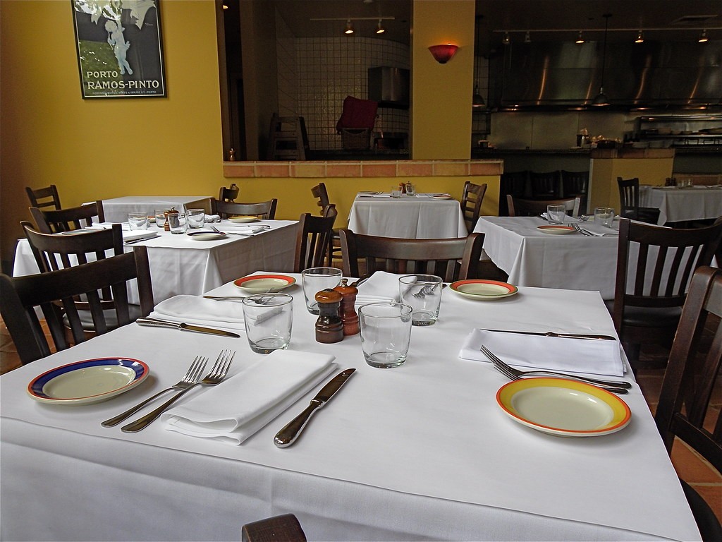 A warm, welcoming restaurant dining room with set tables