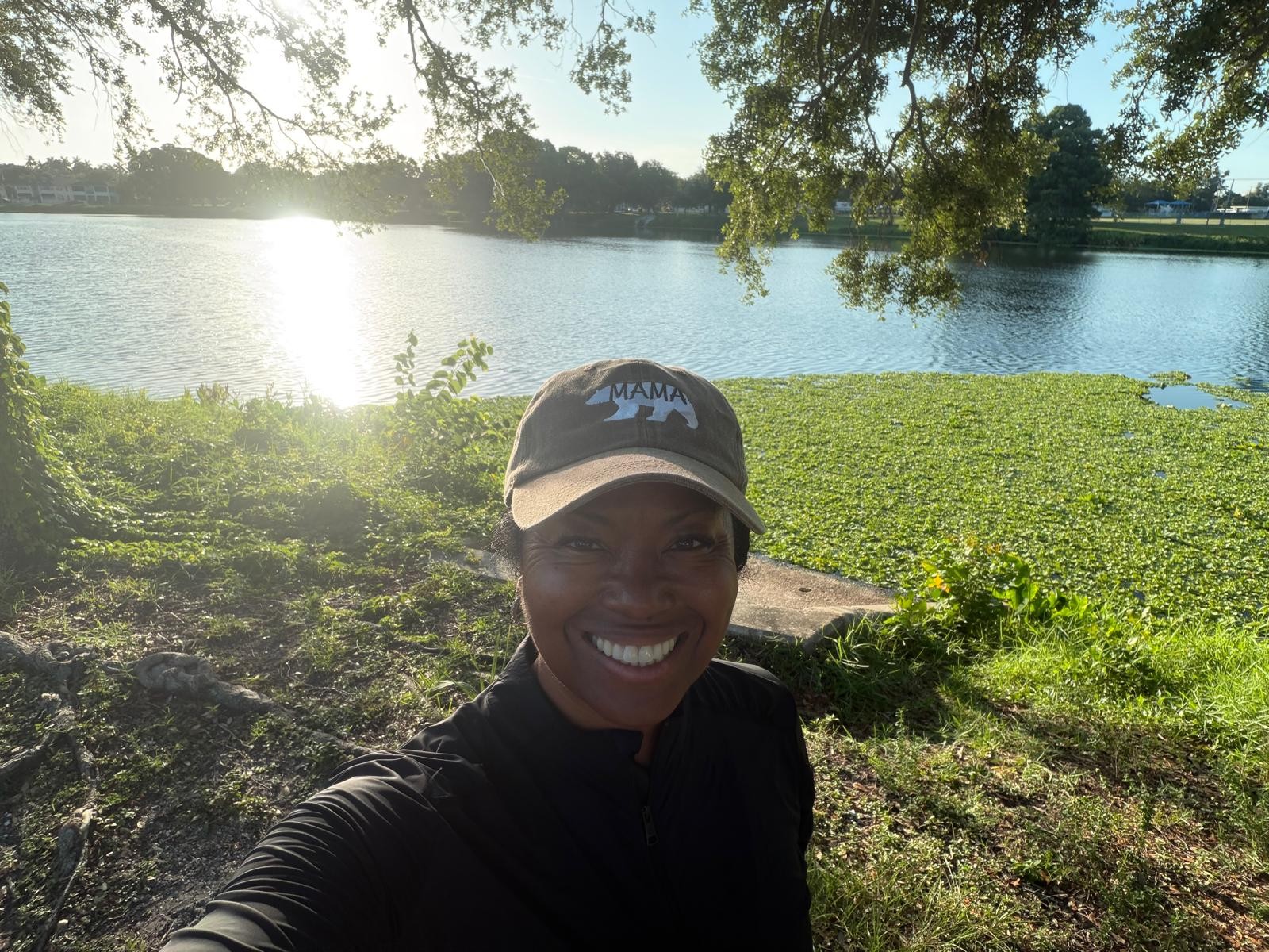 Kimberly in her Mama Bear cap on a morning walk by the lake