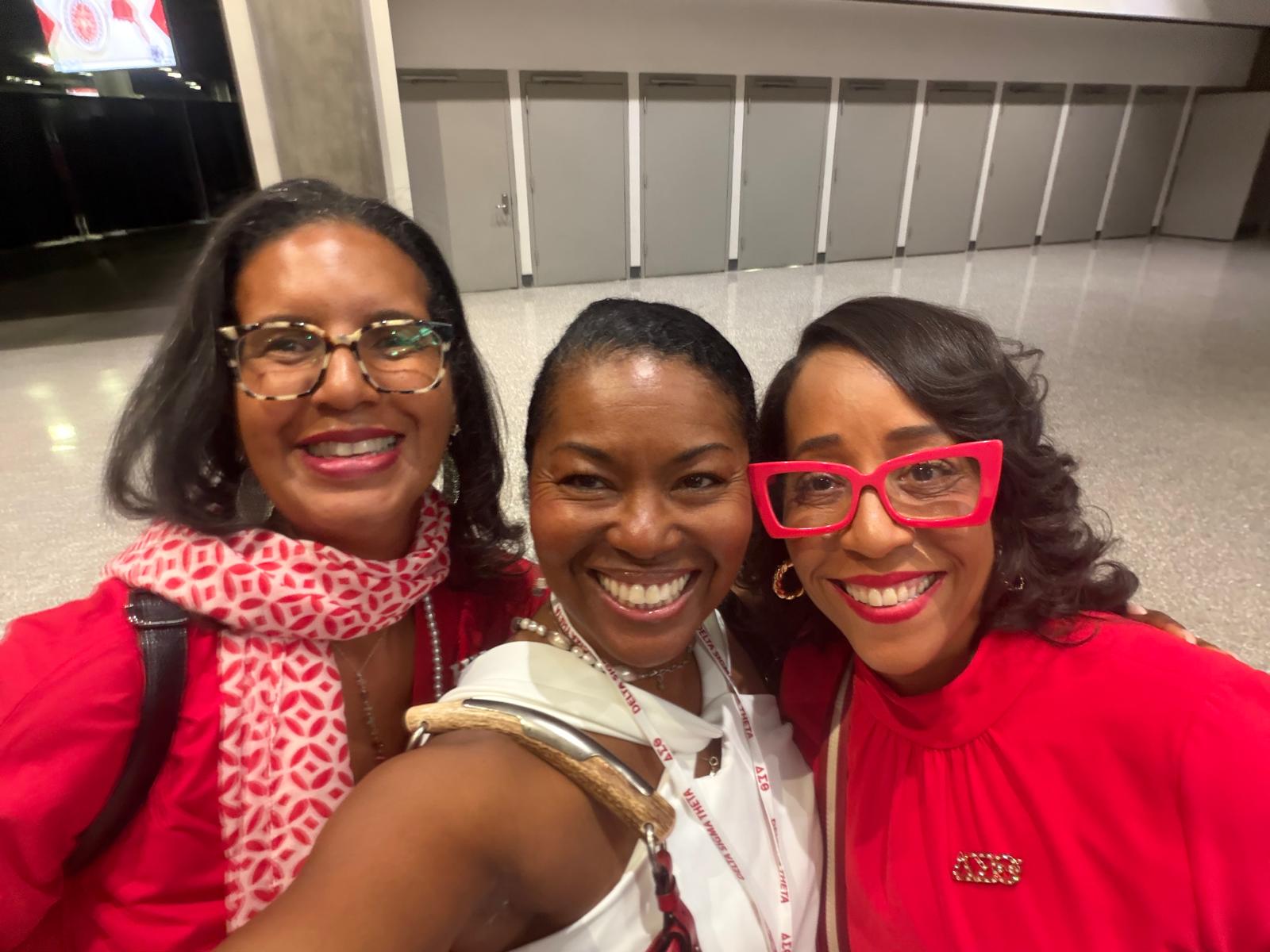 Kimberly with two of her longtime mentors, all dressed in red