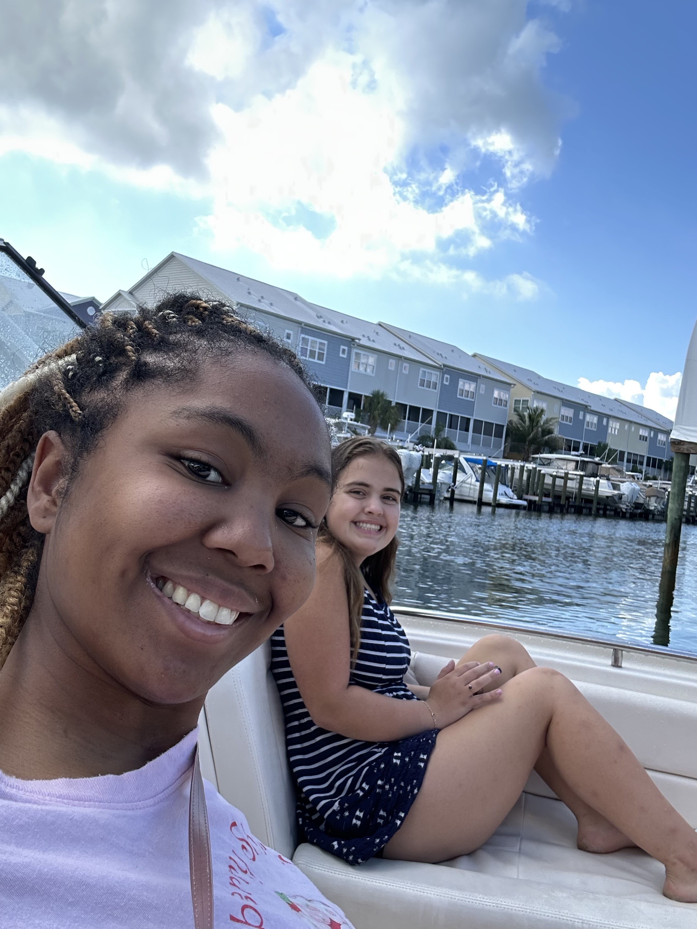 Kimberly and her daughter on a boat at the marina
